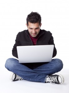 man looking at a laptop