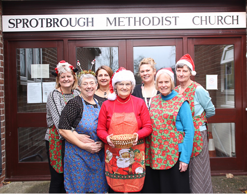 New Beginnings Team Leader Clare Robinson (third from right) and Senior Practitioner Terez Nagy (third from left) with members of Sprotbrough Park Methodist Church at their fundraising Christmas lunch.
