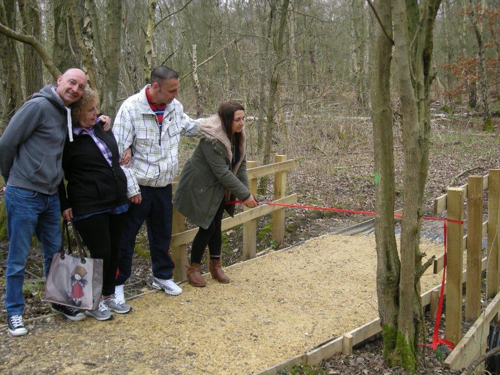 Service users from New Beginnings watch Terez Nagy cut the official ribbon at Potteric Carr’s Discovery Zone.